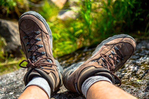 A pair of LOWA Renegade GTX hiking boots overlooking a cliff on the Mont Lafayette